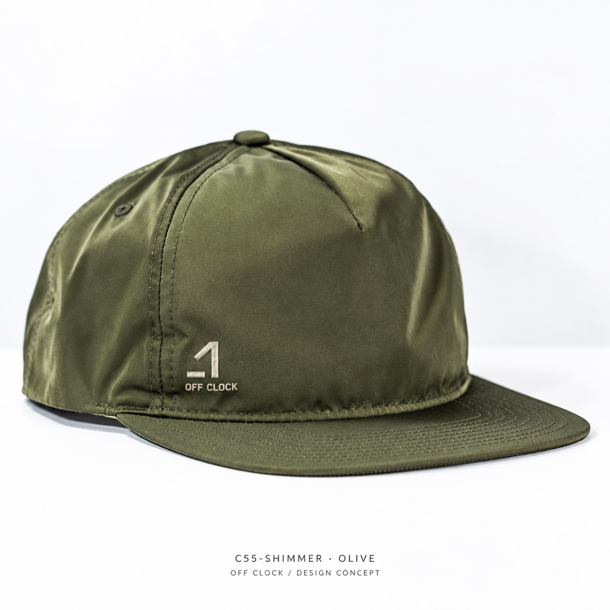 OFF CLOCK olive nylon cap concept with a small ivory embroidered logo and wordmark above the brim
